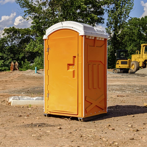 what is the cost difference between standard and deluxe portable restroom rentals in Blaine